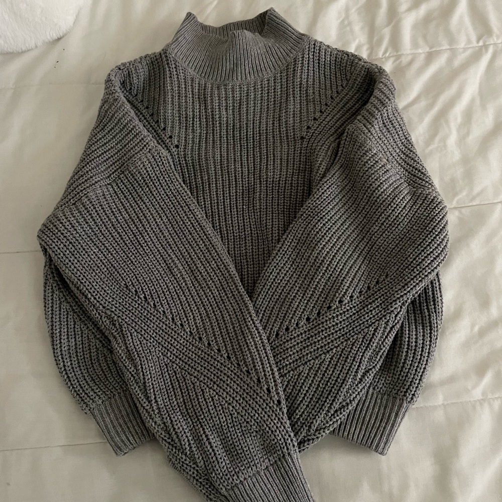 Grey knitted sweater with open back